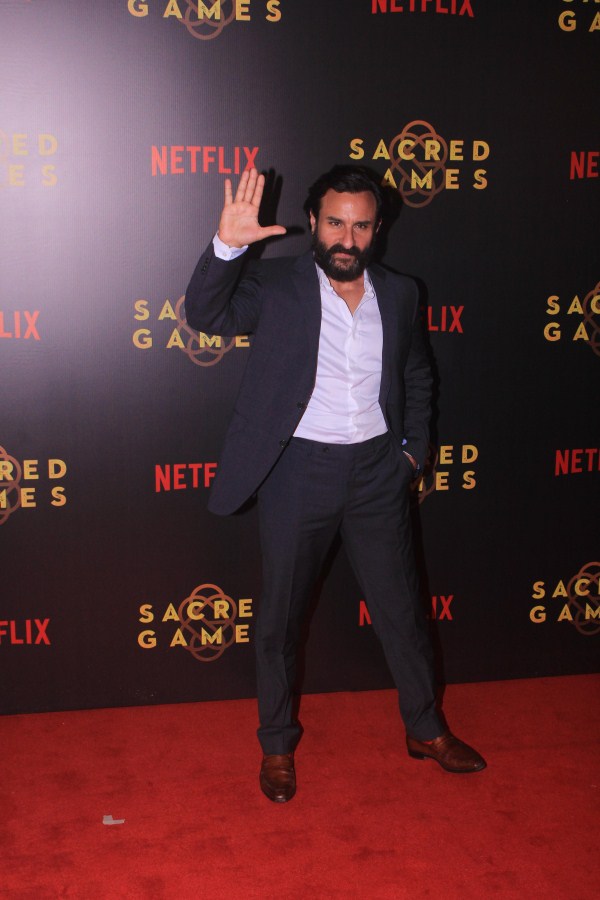 Saif Ali Khan gestures for the cameras on his arrival at Sacred Games premiere in Mumbai. Saif Ali Khan,Radhika Apte,Ishaan Khatter,Sacred Games premiere,Sacred Games premiere pics,Sacred Games premiere images,Sacred Games premiere stills,Sacred Games premiere pictures,Sacred Games premiere photos