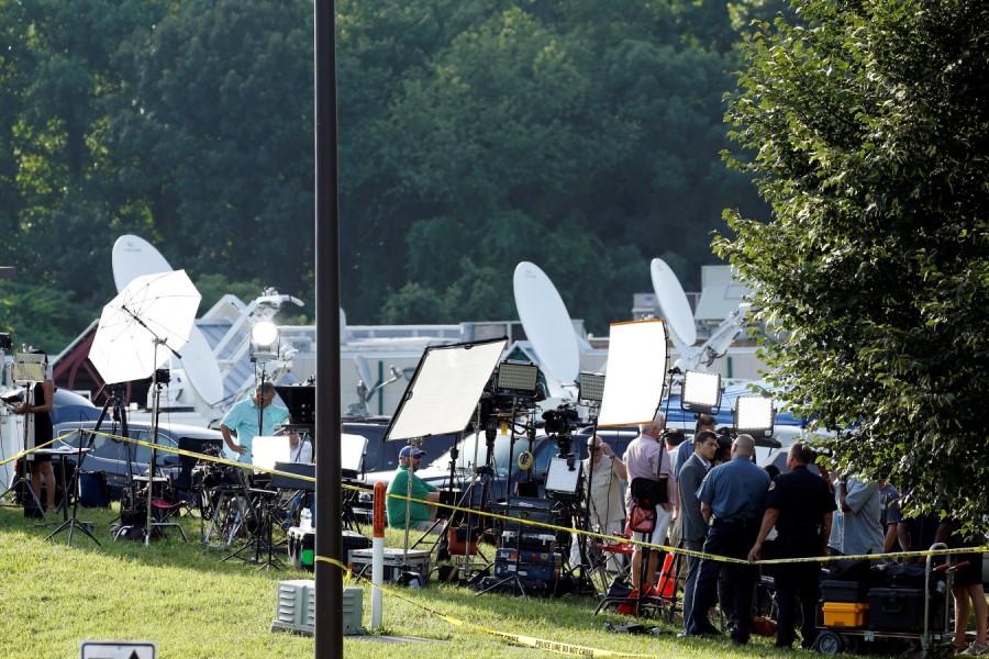 Members of the media report on events the day after a gunman opened fire at the Capital Gazette newspaper's offices, killing five people and injuring several others in Annapolis, Maryland, U.S. Maryland newspaper office,Maryland newspaper office shooting,shooting at Maryland newspaper office,Gazette newspaper