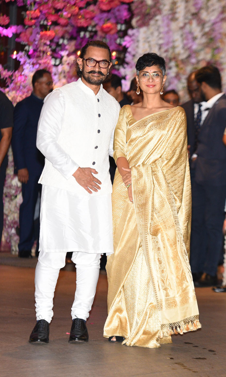 Aamir Khan and his wife Kiran Rao pose together as they arrive for Akash Ambani and Shloka Mehta's engagement party in Mumbai. Shah Rukh Khan,Aamir Khan,Abhishek Bachchan,Aishwarya Rai,Alia Bhatt,Ranbir Kapoor,Akash Ambani and Shloka Mehta's engagement,Akash Ambani and Shloka Mehta's engagement party,Akash Ambani engagement party,Shloka Mehta engagement party