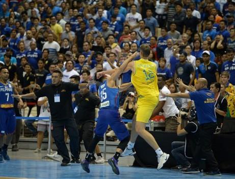 Mathew Wright (L) of the Philipines engage Daniel Kickert of Australia in a brawl during their FIBA World Cup Asian qualifier game at the Philippine arena in Bocaue town, Bulacan province, north of Manila on July 2, 2018. Australia won by default 89-53.