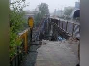 Part of a Road Over Bridge (ROB) collapsed in Mumbai's Andheri West during early morning hours on Tuesday, injuring two people in the incident. The Gokhale bridge, that connects Andheri East and Andheri West, collapsed on the tracks near Andheri Station. Four fire tenders have been rushed to the spot as it is feared that some people might be trapped under the debris. Even, National Disaster Response Force (NDRF) team has reached the spot. According to Mumbai Fire Brigade (MFB) department, "Some people are feared trapped inside. We are at the spot and trying to check with the locals if someone is missing as they might be trapped under the debris".