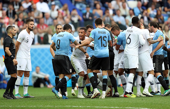 Uruguay pushed France onto the back foot early and Stuani shot across the face of goal after receiving the ball on the left. France started to move the ball with more fluency. Striker Olivier Giroud met right-back Benjamin Pavard's cross from the right at the far post by nodding into the path of Kylian Mbappe, but the Paris Saint-Germain forward sent his looping header over the bar. Despite dictating possession, France rarely looked like scoring as Giroud, Griezmann and Mbappe struggled to find pockets of space. FIFA World Cup 2018,FIFA World Cup,France beats Uruguay,France trash Uruguay,France enters semis,FIFA World Cup pics,FIFA World Cup images,FIFA World Cup stills,FIFA World Cup pictures