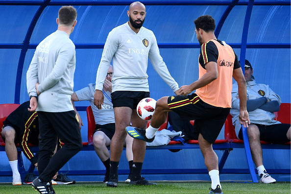Belgium's midfielder Moussa Dembele (R) controls the ball in front of Belgium's assistant coach Thierry Henry (C) during a training session of Belgium's national football team at the Guchkovo Stadium in Dedovsk, outside Moscow, on July 8, 2018, ahead of their Russia 2018 World Cup semi-final football match against France. FIFA World Cup,FIFA World Cup 2018,Belgium begin preparations,Belgium vs France,Belgium vs France semi-final,Belgium vs France semi-final pics,Belgium vs France semi-final images,Belgium vs France semi-final stills