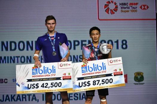Japan's Kento Momota defeated Danish world No 1 Viktor Axelsen 21-14, 21-9 on Sunday to win the Indonesia Open badminton tournament, a BWF Tour 1000 event. Winning the title marks a huge turnaround in the recent fortunes of the 23-year-old Japanese star shuttler. Momota, a former world No 2 who was suspended for just over a year by the Nippon Badminton Association (and missed the Rio Olympics) after admitting in early 2016 that he had visited an illegal casino in his homeland, struggled at the start of his comeback last year, reported Efe. On Sunday, Momota rolled to a straight sets win over Axelsen, who had rallied for an 18-21, 21-14, 21-11 victory over Chinese world No 3 Shi Yuqi in the semi-finals on Saturday.
