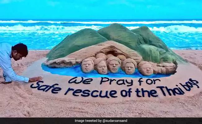 "I created this sand sculpture with my prayers for the rescue of the boys stuck inside the cave. I pray to God that the boys return home safely," said Pattnaik. For the unversed, 13 footballers were found by the British divers on July 2, with footage showing them visibly weak and huddled on a mud mound deep inside the Tham Luang cave. Sand artist Sudarshan Pattnaik,Sudarshan Pattnaik,Sudarshan Pattnaik sand art,Sudarshan Pattnaik sand art pics,Sudarshan Pattnaik sand art images,Thai Cave Rescue,Thai Cave Rescue sand art