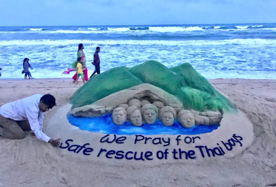 Out of 13 Wild Boars soccer team members, eight have so far been rescued from the Tham Luang cave in northern Thailand's Chiang Rai. The Rest five still remain trapped. Sand artist Sudarshan Pattnaik,Sudarshan Pattnaik,Sudarshan Pattnaik sand art,Sudarshan Pattnaik sand art pics,Sudarshan Pattnaik sand art images,Thai Cave Rescue,Thai Cave Rescue sand art