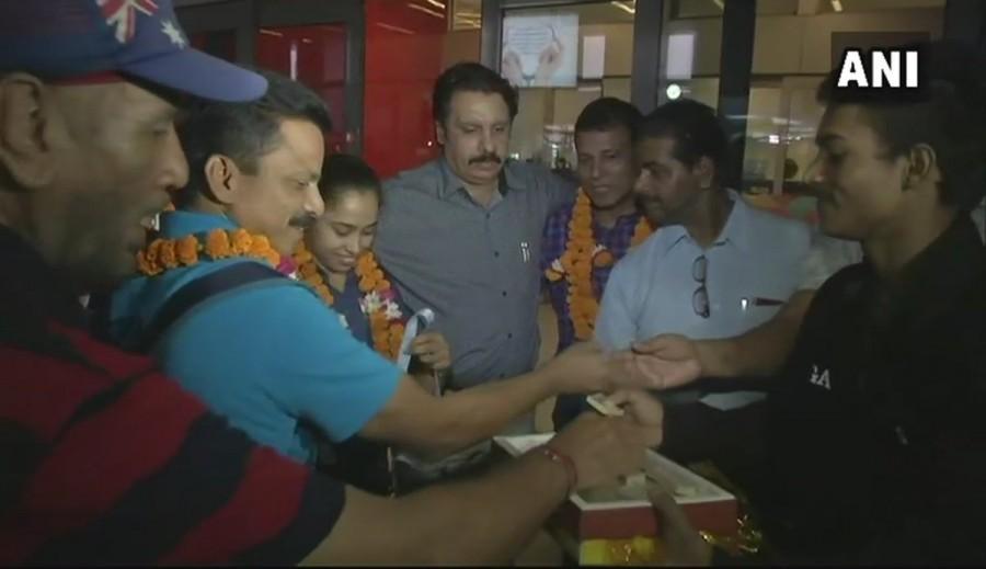 Gymnast Dipa Karmakar on Tuesday returned to India after clinching gold in the vault event at the FIG Artistic Gymnastics World Cup Challenge Cup in Ankara, Turkey. Karmakar expressed gratitude to her coach and the Sports Authority of India for their support, which motivated her to perform better. The 24-year-old, who had acquired the fourth spot in the vault event of the 2016 Rio Olympics, scored 14.150 to secure the top position in the tournament. The gymnast was out of action after her impressive performance in Rio Olympics because of an Anterior Cruciate Ligament injury. Dipa's name has been included in the 10-member Indian gymnastics team for the Asian Games, which are slated to begin from August 18. Gymnast Dipa Karmakar,Dipa Karmakar returns to India,Dipa Karmakar golden win,Gymnastics World Challenge Cup,FIG Artistic Gymnastics,World Cup Challenge Cup