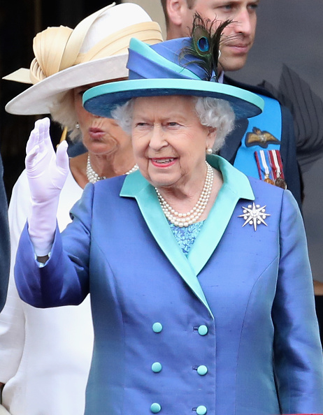 Queen Elizabeth II watches the RAF flypast on the balcony of Buckingham Palace, as members of the Royal Family attend events to mark the centenary of the RAF on July 10, 2018 in London, England. Royal Air Force,Royal Air Force 100th Anniversary,Prince Charles,Prince of Wales,Prince Andrew,Duke of York,Camilla,Duchess of Cornwall,Queen Elizabeth II,Meghan,Duchess of Sussex,Prince Harry