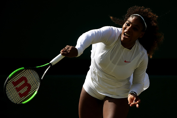 Serena Williams of the United States serves against Camila Giorgi of Italy during their Ladies' Singles Quarter-Finals match on day eight of the Wimbledon Lawn Tennis Championships at All England Lawn Tennis and Croquet Club on July 10, 2018 in London, England. Serena Williams,Serena Williams enters Wimbledon semis,Serena Williams at Wimbledon,Camila Giorgi,Serena Williams beats Camila Giorgi,Wimbledon,Wimbledon 2018,Wimbledon final