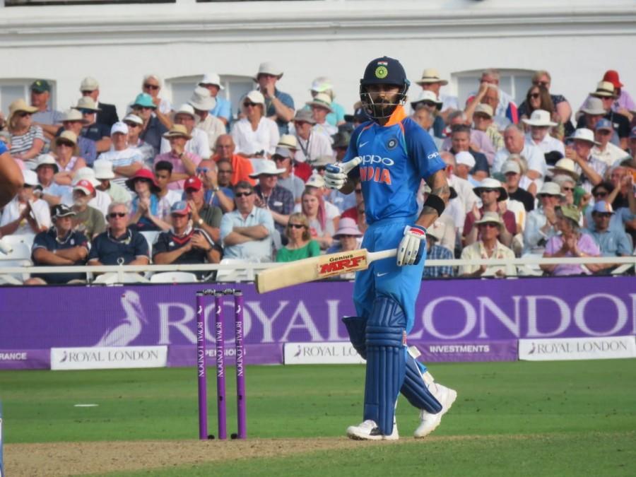 Rohit's innings contained 15 fours and four hits into the stands. Earlier, Kuldeep's heroic bowling effort restricted England at a moderate 268 runs. Despite a deep batting line-up, the hosts' succumbed before the wrist-spinner, who emerged with his best ODI figures at a batting-friendly Nottingham wicket. It was Ben Stokes (50) and Jos Buttler (53), who showed some resistance against the visiting bowling attack to push their side to a fighting total. Put into bat, England was off to a decent start as openers Jason Roy (38) and Jonny Bairstow (38) forged a 73-run partnership for the opening wicket before Kuldeep drew the first blood, dismissing the former in the 11th over. With just eight runs added on England's scorecard, Kuldeep struck again to pack back incoming Joe Root (3). Rohit Sharma,Kuldeep Yadav,Virat Kohli,India thrash England,India beats England,India vs England,India thrash England 1st ODI