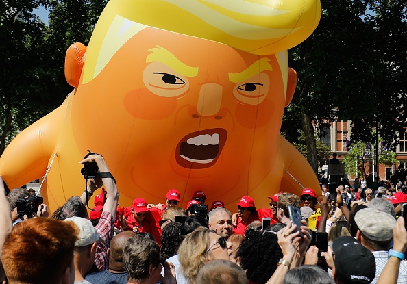 The city of London came to a standstill as thousands of protestors flooded the streets, who voiced their opinion against the US President Donald Trump's visit to the United Kingdom. Initially, only 10,000 were expected to show up, but ultimately 250,000 people gathered for the protest, as per The Hollywood Reporter. The protest gained momentum in several parts of central London after the successful launch of a 'Trump Baby' balloon on the second day of Donald Trump's maiden four-day U.K. visit. The demonstration included a women's march against Trump. Trump Baby,Trump baby balloon,Donald Trump,Donald Trump ballon,Donald Trump ballon pics,Donald Trump ballon images,Donald Trump ballon stills,Donald Trump ballon pictures,Donald Trump ballon photos
