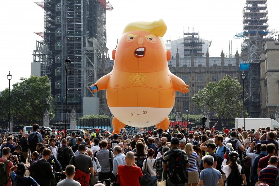 Demonstrators fly a blimp portraying U.S. President Donald Trump, in Parliament Square, during the visit by Trump and First Lady Melania Trump in London. Trump Baby,Trump baby balloon,Donald Trump,Donald Trump ballon,Donald Trump ballon pics,Donald Trump ballon images,Donald Trump ballon stills,Donald Trump ballon pictures,Donald Trump ballon photos
