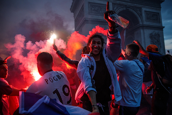 France scored twice in each half as they thumped a combative Croatia 4-2 in a dramatic final to win the FIFA World Cup for the second time in 20 years here on Sunday. A first-ever own goal in a World Cup final gave France the lead as Mario Mandzukic headed a free-kick into his own net in the 18th minute but Croatia pulled level through a strike from Ivan Perisic in the 28th minute. Antoine Griezmann converted a penalty in the 38th minute to regain France's lead which was further increased to 3-1 by Paul Pogba in the 59th minute. Fifa World Cup 2018,Fifa World Cup,Fifa World Cup winner,France,Frace beats Croatia,Croatia,France fans celebrate in Paris