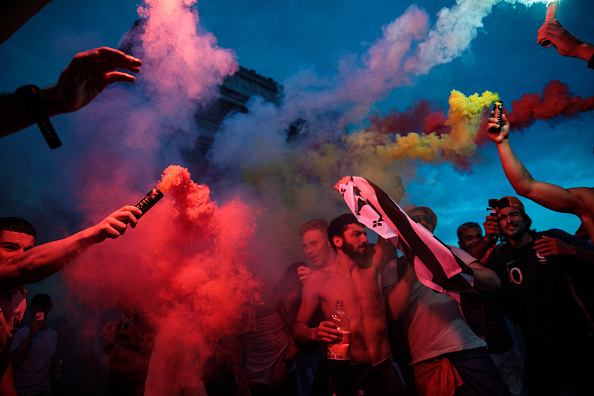 French football fans celebrate into the night around the Arc de Triomph after France's victory against Croatia in the World Cup Final on July 15, 2018 in Paris, France. France beat Croatia 4-2 in the World Cup Final played at Moscow's Luzhniki Stadium today. Fifa World Cup 2018,Fifa World Cup,Fifa World Cup winner,France,Frace beats Croatia,Croatia,France fans celebrate in Paris