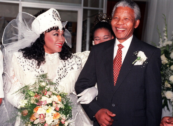 Zinzi Mandela (l), daughter of African National Congress (ANC) President Nelson Mandela, wearing Xhosa traditional outfit, and her father Nelson, smile, 26 October 1992 in Soweto, after Zinzi married Zweli Hlongwane, a black businessman. Nelson Mandela 100th birthday,Nelson Mandela birthday,Nelson Mandela rare pics,Nelson Mandela rare images,Nelson Mandela rare stills,Nelson Mandela rare pictures,Nelson Mandela rare photos,Nelson Mandela unseen pics,Nelson Mandela unseen images,Nelson Man