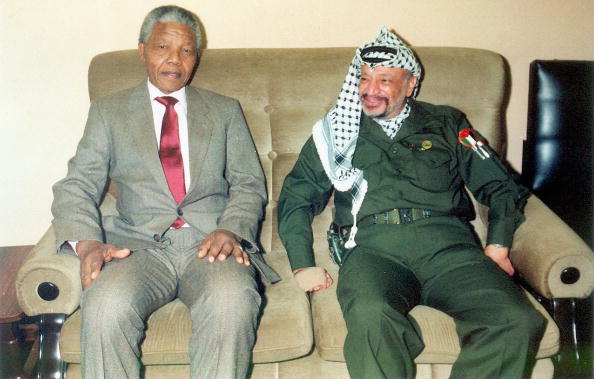 Palestinian leader Yasser Arafat is pictured meeting with Nelson Mandela the former leader of South Africa in Gaza City. Medics announced on October 31, 2004 that Arafat's health is in a serious condition, after the illness that has persisted for two weeks, took a sudden turn for the worse. Test have so far proved inconclusive and more results are expected on Wednesday. Nelson Mandela 100th birthday,Nelson Mandela birthday,Nelson Mandela rare pics,Nelson Mandela rare images,Nelson Mandela rare stills,Nelson Mandela rare pictures,Nelson Mandela rare photos,Nelson Mandela unseen pics,Nelson Mandela unseen images,Nelson Man