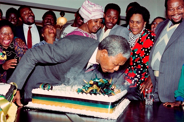 Nelson MandelaSouth African anti-apartheid leader and African National Congress (ANC) member Nelson Mandela blows candles on his 72nd birthday cake, the first he has celebrated as a free man since 1960, on July 18, 1990 in his Soweto home as his then-wife anti-apartheid campaigner Winnie (c), family and friends look on. Nelson Mandela 100th birthday,Nelson Mandela birthday,Nelson Mandela rare pics,Nelson Mandela rare images,Nelson Mandela rare stills,Nelson Mandela rare pictures,Nelson Mandela rare photos,Nelson Mandela unseen pics,Nelson Mandela unseen images,Nelson Man