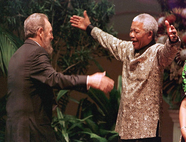 South African President Nelson Mandela greets Cuban leader Fidel Castro as he arrives for the opening of the 12th Non-Aligned Movement summit in Durban 02 September 1998. Nelson Mandela 100th birthday,Nelson Mandela birthday,Nelson Mandela rare pics,Nelson Mandela rare images,Nelson Mandela rare stills,Nelson Mandela rare pictures,Nelson Mandela rare photos,Nelson Mandela unseen pics,Nelson Mandela unseen images,Nelson Man