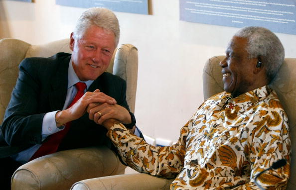 Former U.S. President Bill Clinton (L) embraces former South African President Nelson Mandela following remarks by Clinton during a visit to the Nelson Mandela Foundation July 19, 2007 in Johannesburg. Clinton is on an eight day trip to the African continent to visit sites supported and founded by the Clinton Foundation. Nelson Mandela 100th birthday,Nelson Mandela birthday,Nelson Mandela rare pics,Nelson Mandela rare images,Nelson Mandela rare stills,Nelson Mandela rare pictures,Nelson Mandela rare photos,Nelson Mandela unseen pics,Nelson Mandela unseen images,Nelson Man