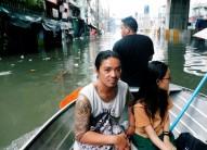 Residents are transported on a canoe along a flooded street caused by monsoon rains and Tropical Storm Son-Tinh in Quezon city, Metro Manila, in Philippines July 17, 2018.