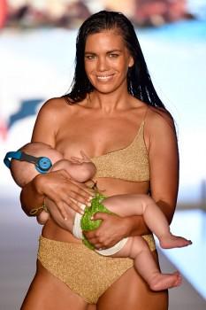 Model Mara Martin turned heads at the Sports Illustrated swimsuit fashion show on Sunday, when she walked the ramp while breastfeeding her five-month-old infant. The 35-year-old took the concept of 'Take Your Kids to Work Day' to a whole new level and the Twitterverse can't stop talking about it. Twitterers showered their support for the model on the micro-blogging site.