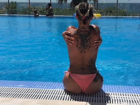 Kerry Katona goes topless