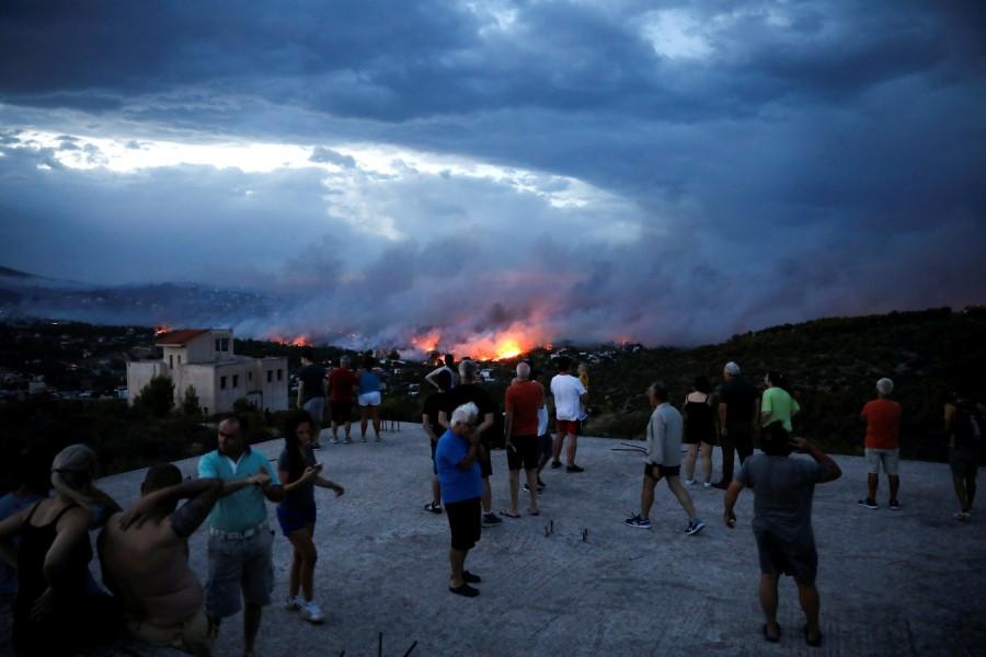Wildfire rages near Athens Athens wildfire,Athens fire,Athens wildfire pics,Athens wildfire images,Greek capital,Orange smoke,Wildfire rages near Athens