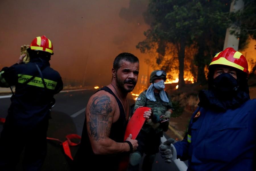More than 20 dead as fires rage near Athens Athens wildfire,Athens fire,Athens wildfire pics,Athens wildfire images,Greek capital,Orange smoke,Wildfire rages near Athens