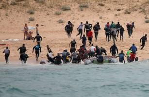 Boat full of migrants,Spanish beach,migrants on Spanish beach,30 illegal migrants