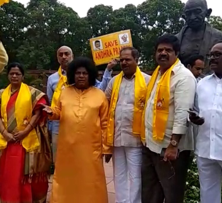 TDP MP's continue their protest in Parliament demanding special status Telegu Desam Party,TDP MP Naramalli Sivaprasad,MP Naramalli Sivaprasad,Naramalli Sivaprasad,Naramalli Sivaprasad as Sathya Sai,Naramalli Sivaprasad in Sathya Sai avatar,Sathya Sai avatar,Sathya Sai Baba