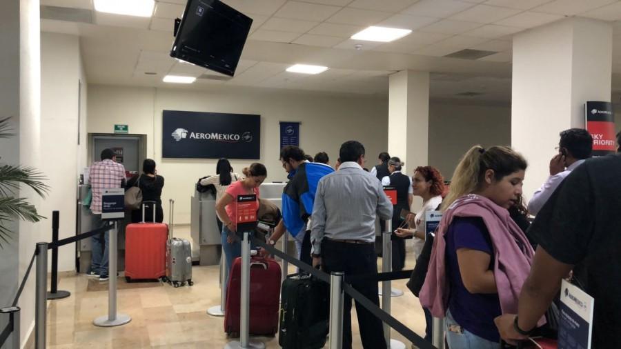 People stand in line at the Aeromexico desk Aeromexico plane,Aeromexico plane crashes,Aeromexico commercial flight,Durango,Aeromexico plane crashes in Durango