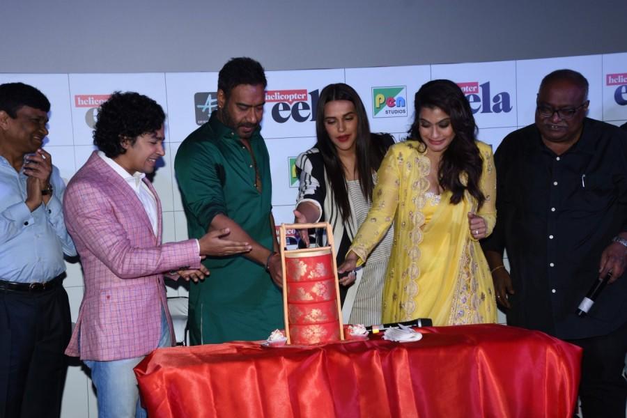 Kajol cuts her birthday cake Helicopter Eela trailer launch,Helicopter Eela trailer,Kajol,Ajay Devgn,Neha Dhupia,Kajol birthday celebration,Kajol birthday celebration pics,Kajol birthday celebration images,Kajol birthday celebration stills,Helicopter Eela trailer launch pics,Helicopt