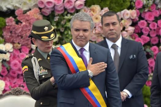 Ivan Duque gestures after receiving the presidential sash
