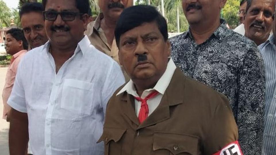 TDP MP turns up as Adolf Hitler TDP MP,TDP MP Naramalli Sivaprasad,Naramalli Sivaprasad,Naramalli Sivaprasad as Hitler,Naramalli Sivaprasad Hitler look,Hitler,Adolf Hitler,AP special status,Andhra Pradesh special status
