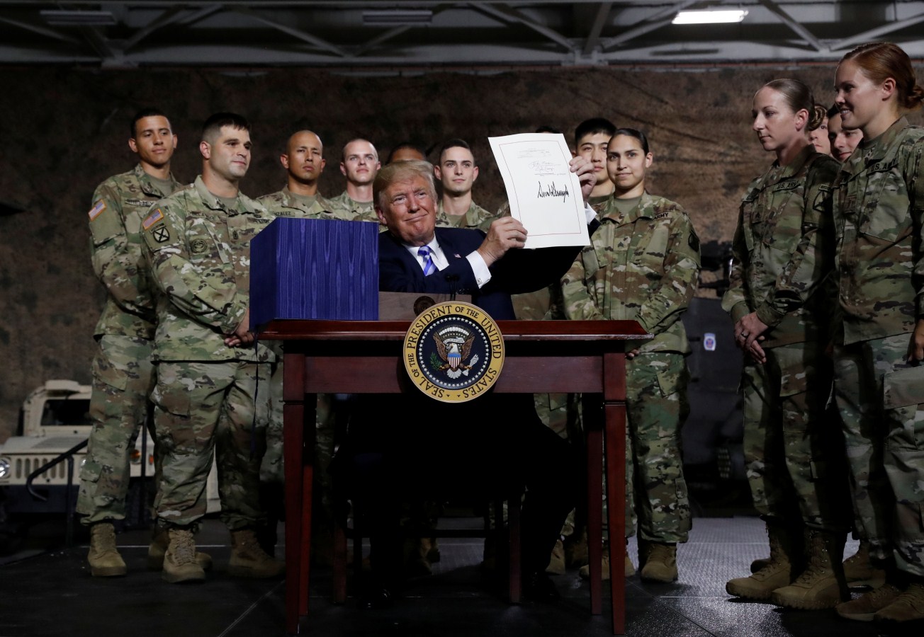 President Donald Trump Signs $716 Billion Defence Policy Bill - Photos ...