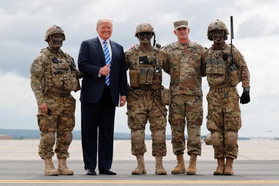 Donald Trump gives a thumbs up as he poses with soldiers President Donald Trump,Donald Trump,defence policy bill