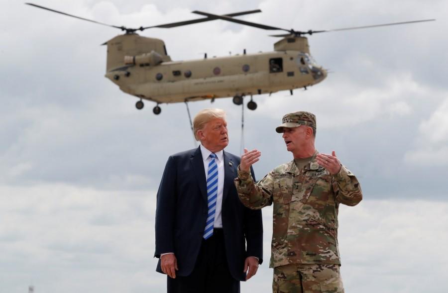 President Donald Trump talks with U.S. Army Major General Walter “Walt” Piatt President Donald Trump,Donald Trump,defence policy bill