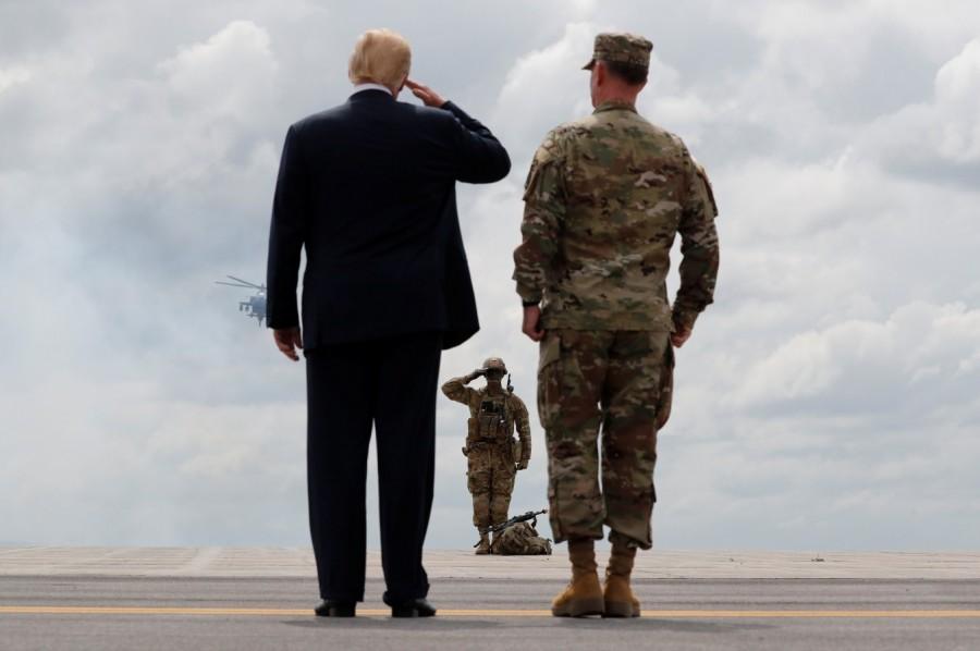 Donald Trump salutes a U.S. Army soldier President Donald Trump,Donald Trump,defence policy bill