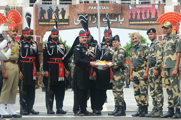 India's Border Security Force and Pakistan Rangers share sweets at Attari-Wagah border Attari-Wagah border,Pakistan's 71st Independence Day,Pakistan Independence Day,Pakistan Independence Day celebration,Pakistan Independence Day celebration pics,Pakistan Independence Day celebration images,Pakistan Independence Day celebration stills