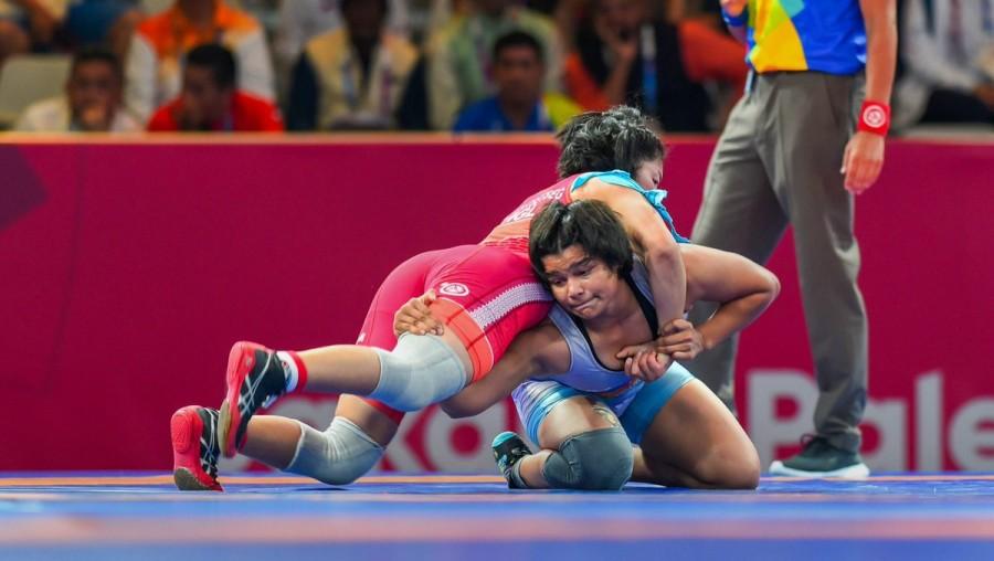 Asian Games 2018: Wrestler Divya Kakran bags bronze Divya Kakran,Divya Kakran bags bronze,Divya Kakran wins bronze,Chinese wrestler Wenling Chen,Wenling Chen,Asian Games 2018,Asian Games