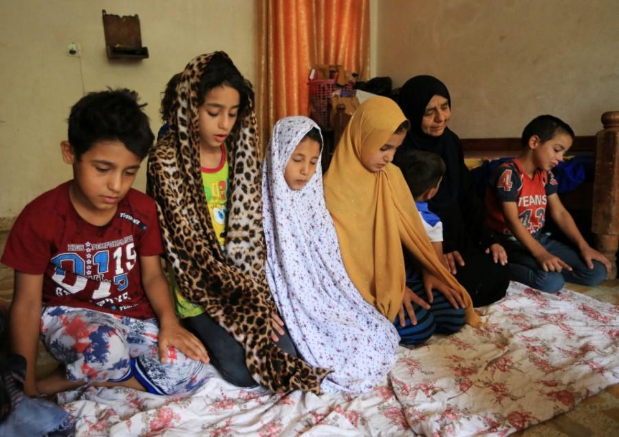 Iraqi grandmother pray with grandchildren at her home Islamic State killed,Sana Ibrahim al-Taee,Iraqi grandmother Sana Ibrahim al-Taee,Islamic,Islamic state