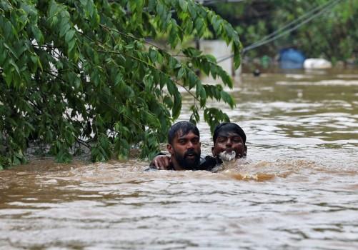 A man rescues a drowning man from a flooded area