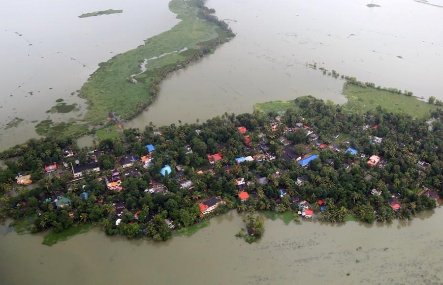An aerial view shows partially submerged houses Kerala floods,Kerala floods pics,Kerala floods images,Kerala floods stills,Kerala floods pictures,Kerala floods photos,Kerala worst flood