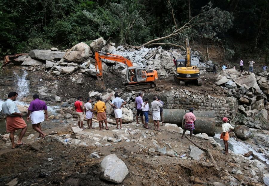 PWD machine repairs a collapsed bridge Kerala floods,Kerala floods pics,Kerala floods images,Kerala floods stills,Kerala floods pictures,Kerala floods photos,Kerala worst flood