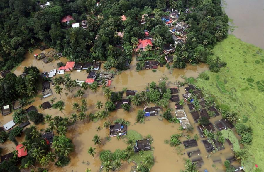 An aerial view shows partially submerged houses Kerala floods,Kerala floods pics,Kerala floods images,Kerala floods stills,Kerala floods pictures,Kerala floods photos,Kerala worst flood