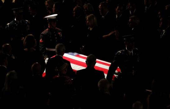 The honor guard carries the casket