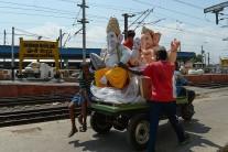 Indian workers carry an idol of the elephant-headed Hindu deity Lord Ganesha