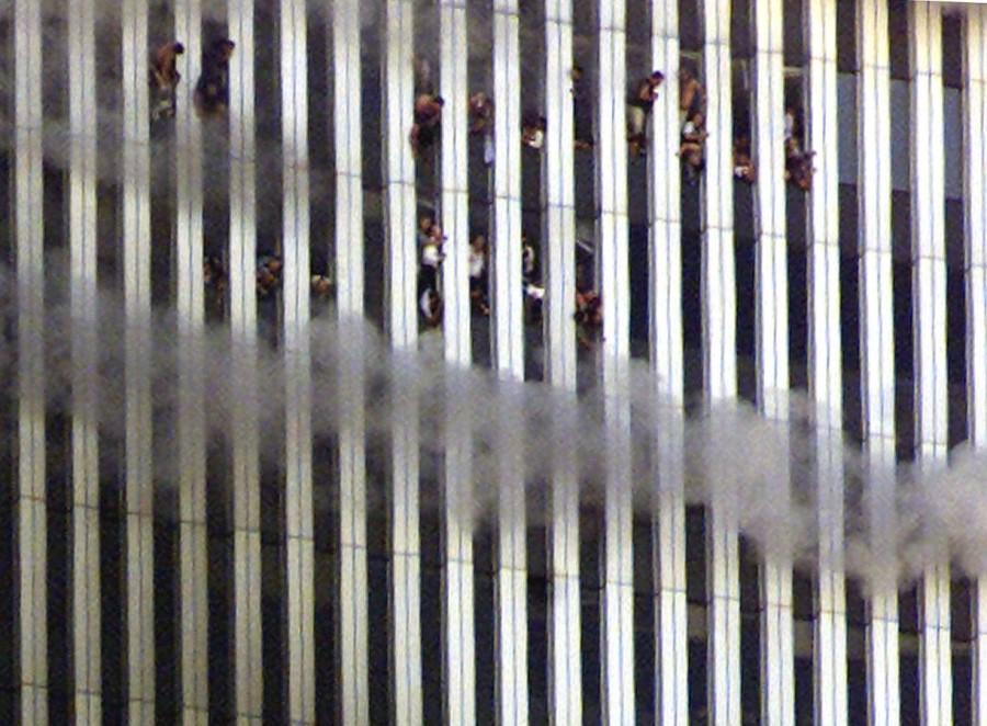 People look out of the burning North tower of the World Trade Center in New York City World Trade Center,World Trade Center attack,September 11 attack,Twin Towers attack,pentagon attack,9/11,9/11 pictures,World Trade Center attack pictures,powerful post attack pictures,United States,hijacked airplane,New York City,Pentagon building,north t
