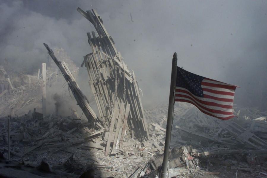 An American flag flies near the base of the destroyed World Trade Center World Trade Center,World Trade Center attack,September 11 attack,Twin Towers attack,pentagon attack,9/11,9/11 pictures,World Trade Center attack pictures,powerful post attack pictures,United States,hijacked airplane,New York City,Pentagon building,north t