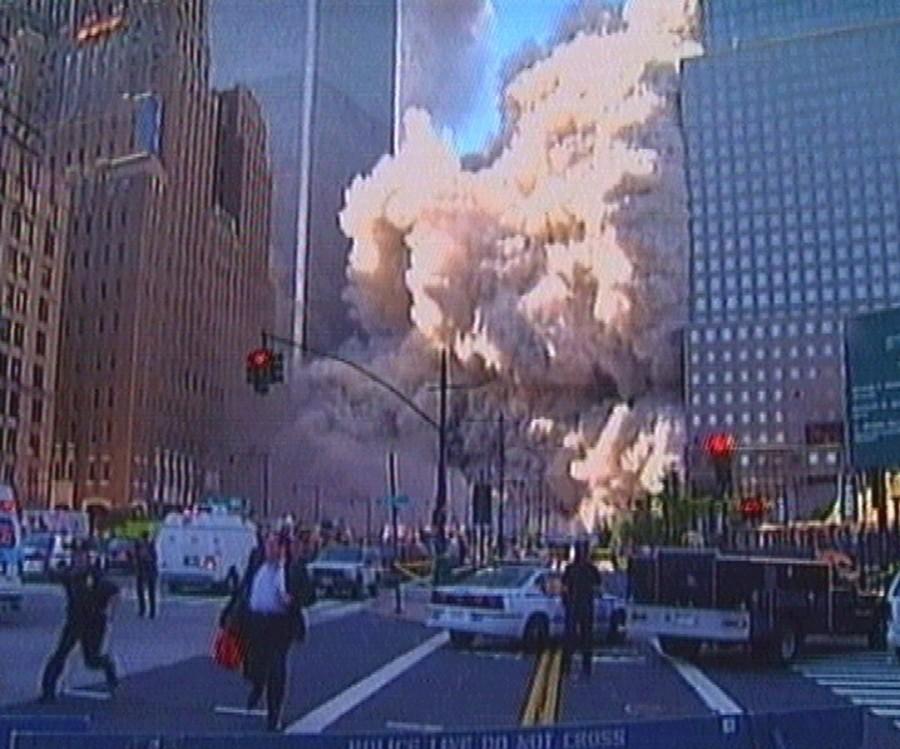 Pedestrians and police run as a tower of the World Trade Center collapses World Trade Center,World Trade Center attack,September 11 attack,Twin Towers attack,pentagon attack,9/11,9/11 pictures,World Trade Center attack pictures,powerful post attack pictures,United States,hijacked airplane,New York City,Pentagon building,north t